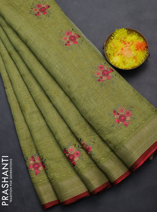 linen cotton saree light green and maroon with allover embroidery work and zari woven border