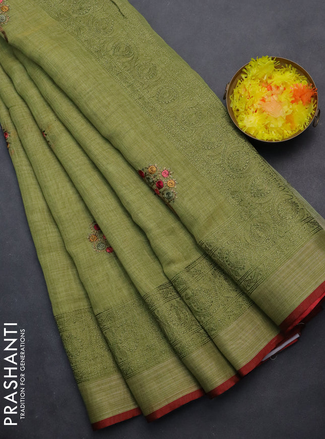 linen cotton saree light green and maroon with embroidery buttas and zari woven border
