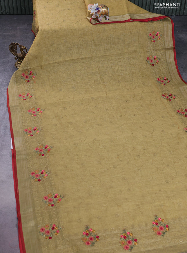 linen cotton saree mustrad green and red with allover embroidery work and zari woven border