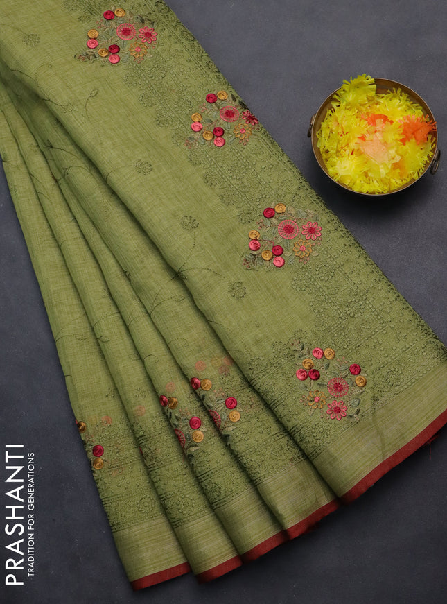 linen cotton saree light green and maroon with allover embroidery work and zari woven border