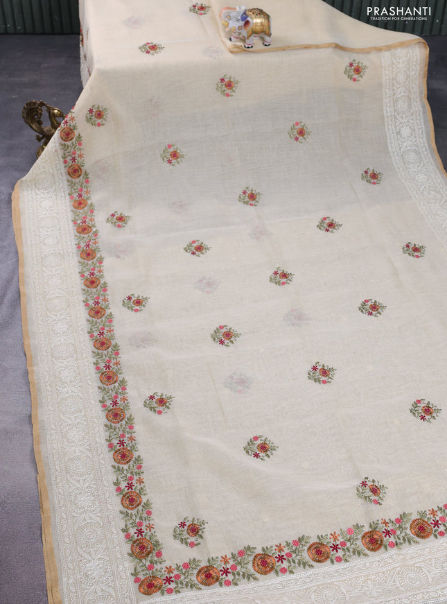 linen cotton saree cream and rust shade with floral embroidery buttas and embroidery border