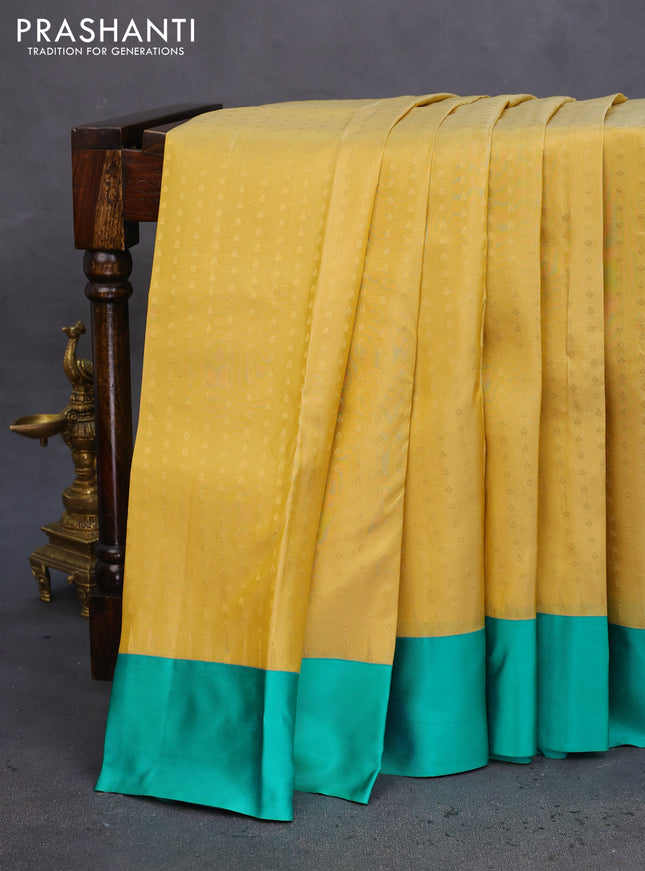 Pure kanchipuram silk saree yellow shade and teal green with allover zari woven 1000 buttas and temple design simple korvai border