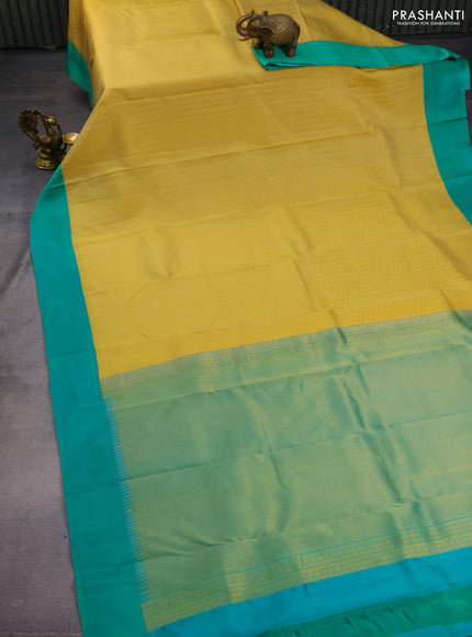 Pure kanchipuram silk saree yellow shade and teal green with allover zari woven 1000 buttas and temple design simple korvai border