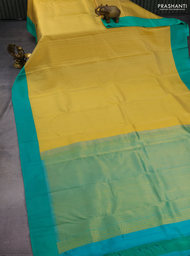 Pure kanchipuram silk saree yellow shade and teal green with allover zari woven 1000 buttas and temple design simple korvai border