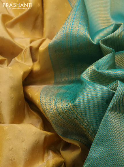 Pure kanchipuram silk saree yellow shade and teal green with allover zari woven 1000 buttas and temple design simple korvai border