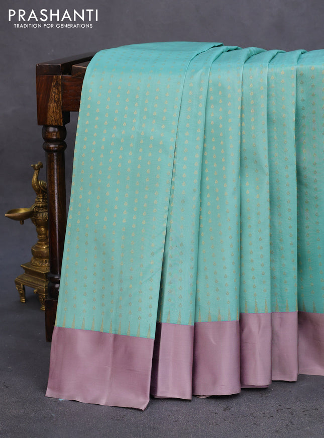 Pure kanchipuram silk saree pastel blue and grey shade with allover zari woven 1000 buttas and temple design simple korvai border