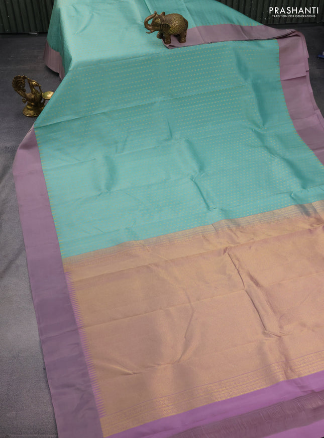 Pure kanchipuram silk saree pastel blue and grey shade with allover zari woven 1000 buttas and temple design simple korvai border