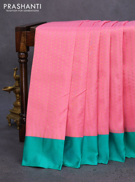Pure kanchipuram silk saree peach pink and teal green with allover zari woven 1000 buttas and temple design simple korvai border