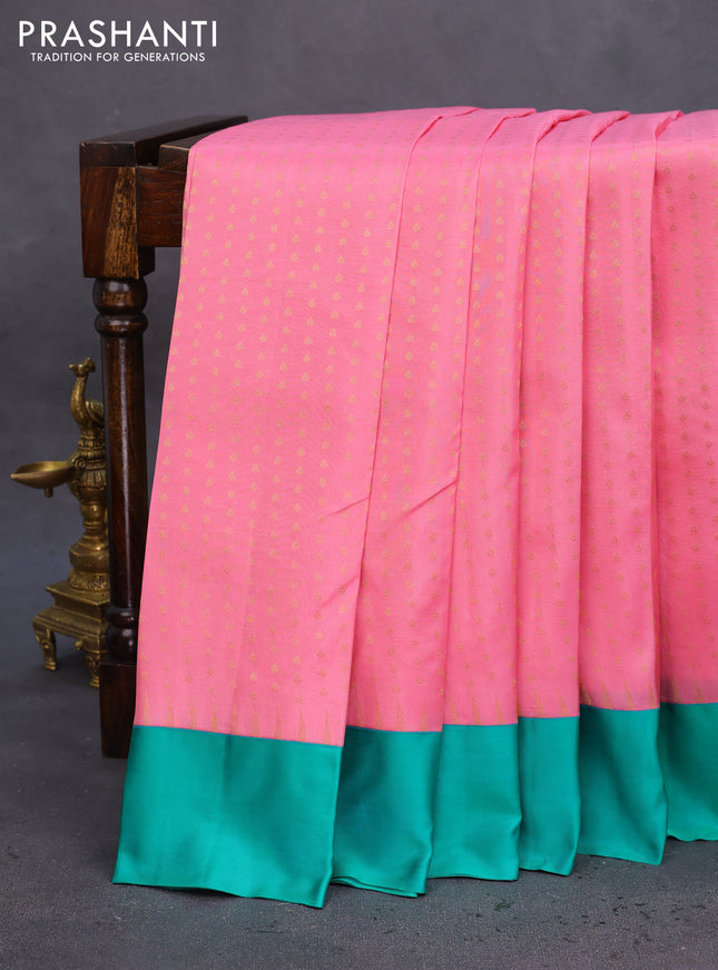 Pure kanchipuram silk saree peach pink and teal green with allover zari woven 1000 buttas and temple design simple korvai border