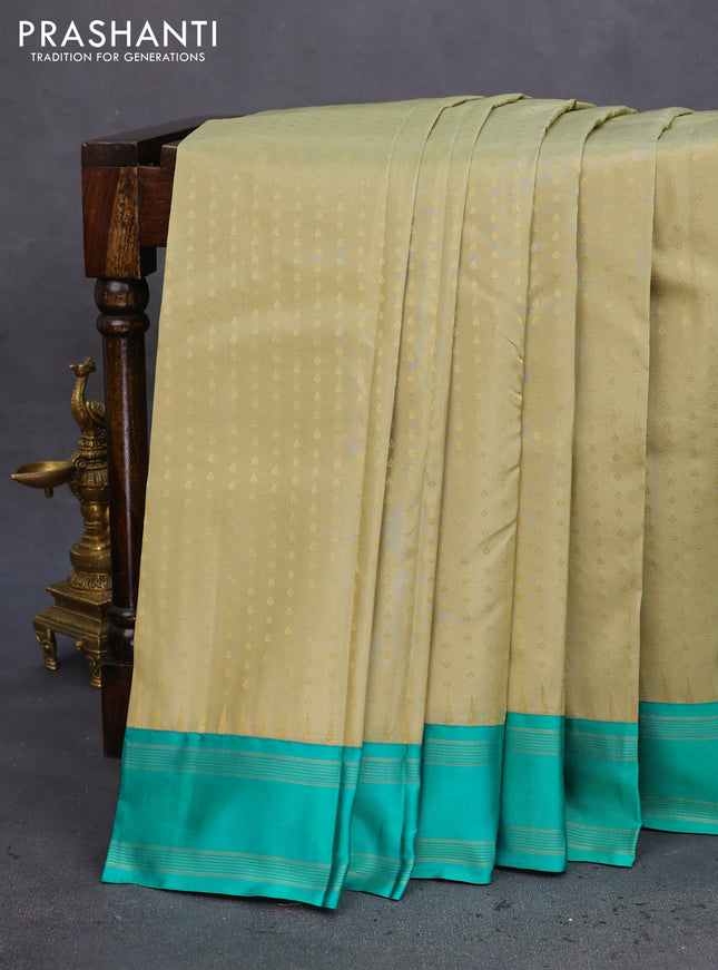 Pure kanchipuram silk saree elaichi green and teal green with allover zari woven 1000 buttas and temple design simple korvai border