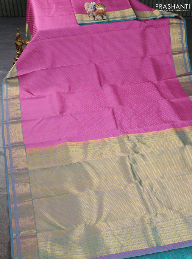 Pure kanchipuram silk saree mauve pink and dual shade of teal blue with allover self emboss & zari buttas and zari woven border