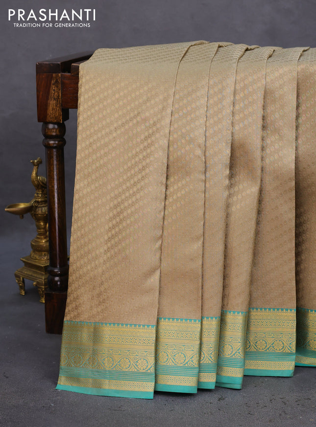 Pure kanchipuram silk saree beige and teal green with allover self emboss & zari buttas and zari woven border