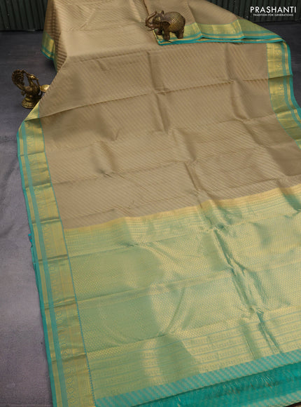 Pure kanchipuram silk saree beige and teal green with allover self emboss & zari buttas and zari woven border