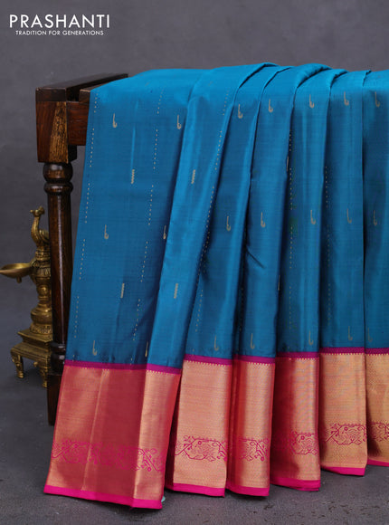 Pure kanchipuram silk saree peacock green and pink with allover zari woven muniya buttas and rich zari woven border