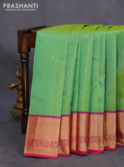 Pure kanchipuram silk saree dual shade of green and magenta pink with allover zari woven muniya buttas and rich zari woven border