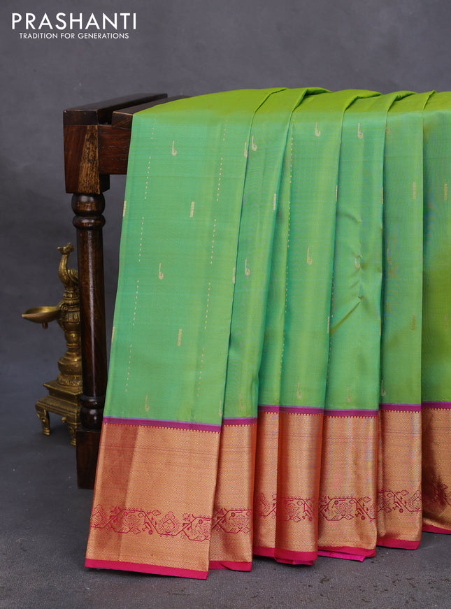 Pure kanchipuram silk saree dual shade of green and magenta pink with allover zari woven muniya buttas and rich zari woven border