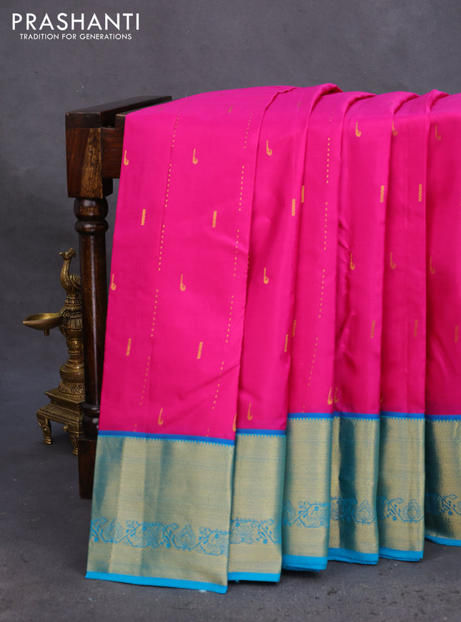 Pure kanchipuram silk saree pink and dual shade of teal blue with allover zari woven muniya buttas and rich zari woven border