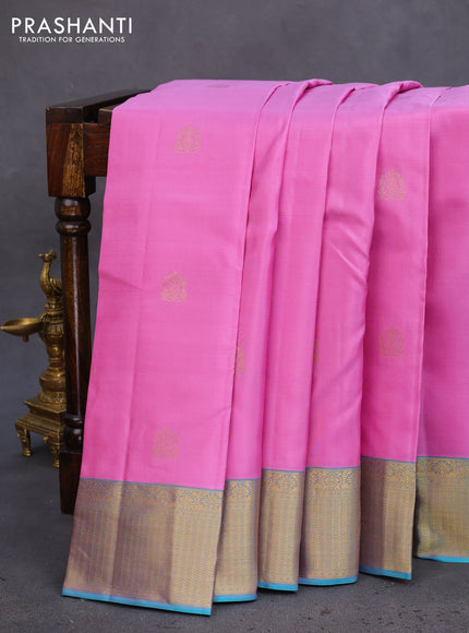 Pure kanchipuram silk saree light pink and teal blue with allover zari woven buttas and rich zari woven border