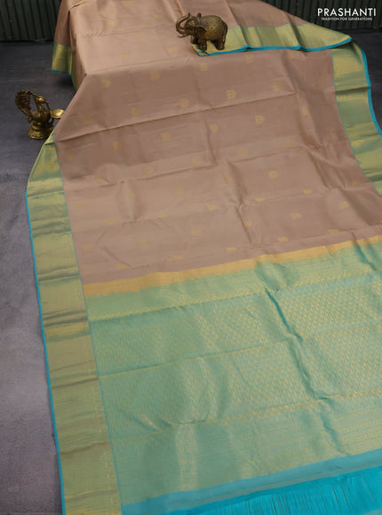 Pure kanchipuram silk saree beige and teal blue with allover zari woven buttas and rich zari woven border