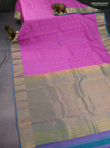 Pure kanchipuram silk saree lotus pink and dual shade of teal blue with allover zari woven buttas and rich zari woven border