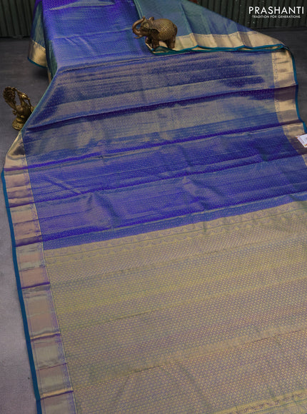 Pure kanchipuram silk saree dual shade of bluish green with allover zari weaves and zari woven border