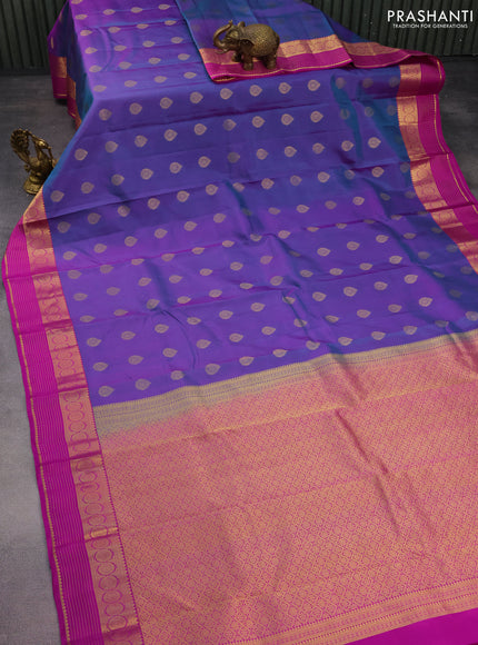 Pure kanchipuram silk saree dual shade of bluish purple and purple with allover zari woven buttas and zari woven border
