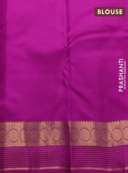 Pure kanchipuram silk saree dual shade of bluish purple and purple with allover zari woven buttas and zari woven border
