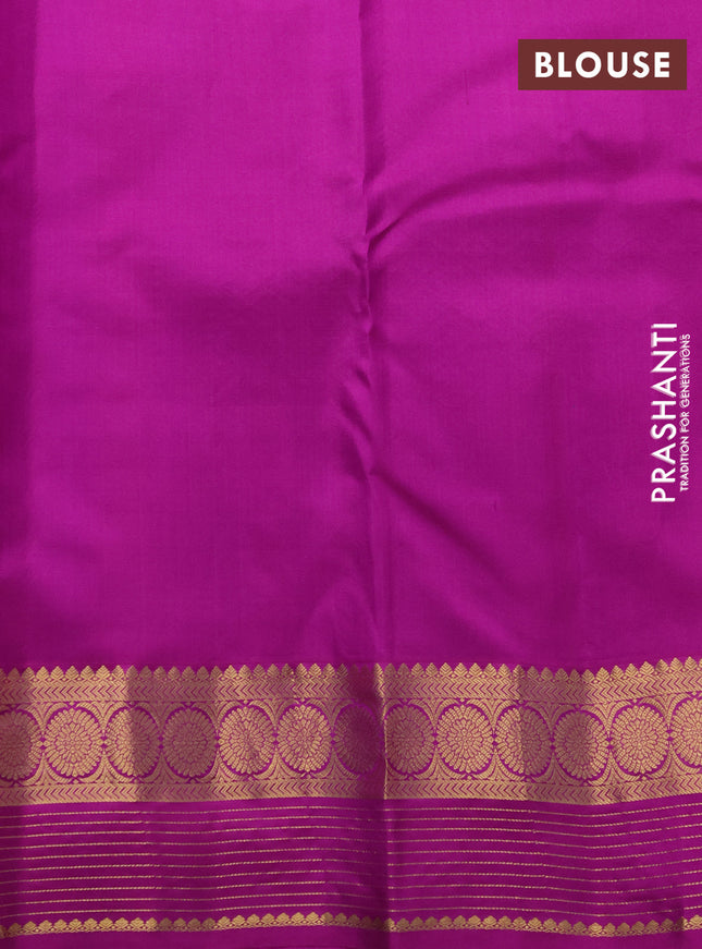 Pure kanchipuram silk saree dual shade of bluish purple and purple with allover zari woven buttas and zari woven border
