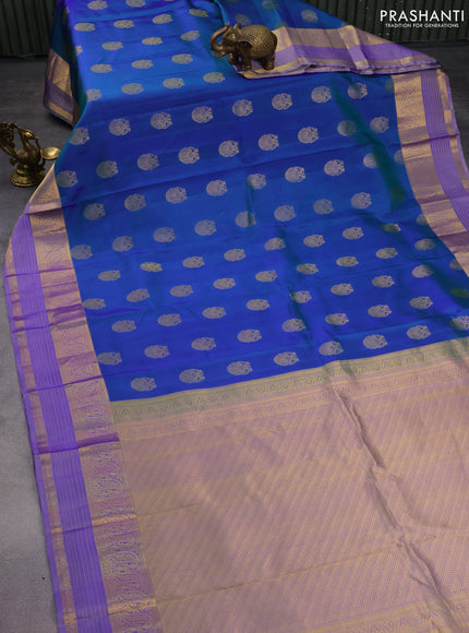 Pure kanchipuram silk saree dual shade of bluish green and lavender with annam zari woven buttas and zari woven border