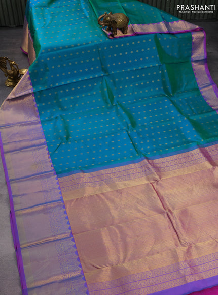 Pure kanchipuram silk saree dual shade of teal green and purple with zari woven buttas and zari woven border