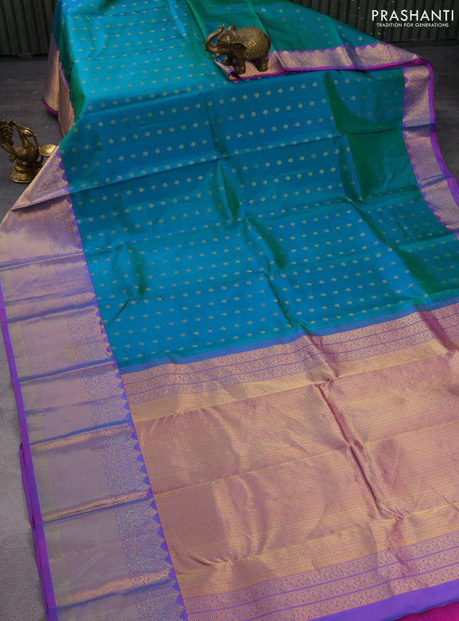 Pure kanchipuram silk saree dual shade of teal green and purple with zari woven buttas and zari woven border