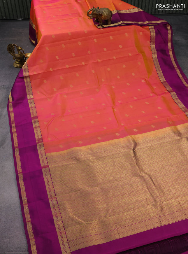 Pure kanchipuram silk saree dual shade of pinkish orange and purple with zari woven buttas and rettapet zari woven border