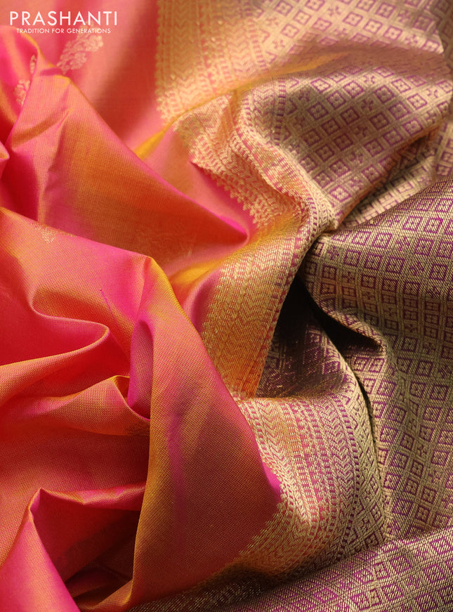 Pure kanchipuram silk saree dual shade of pinkish orange and purple with zari woven buttas and rettapet zari woven border