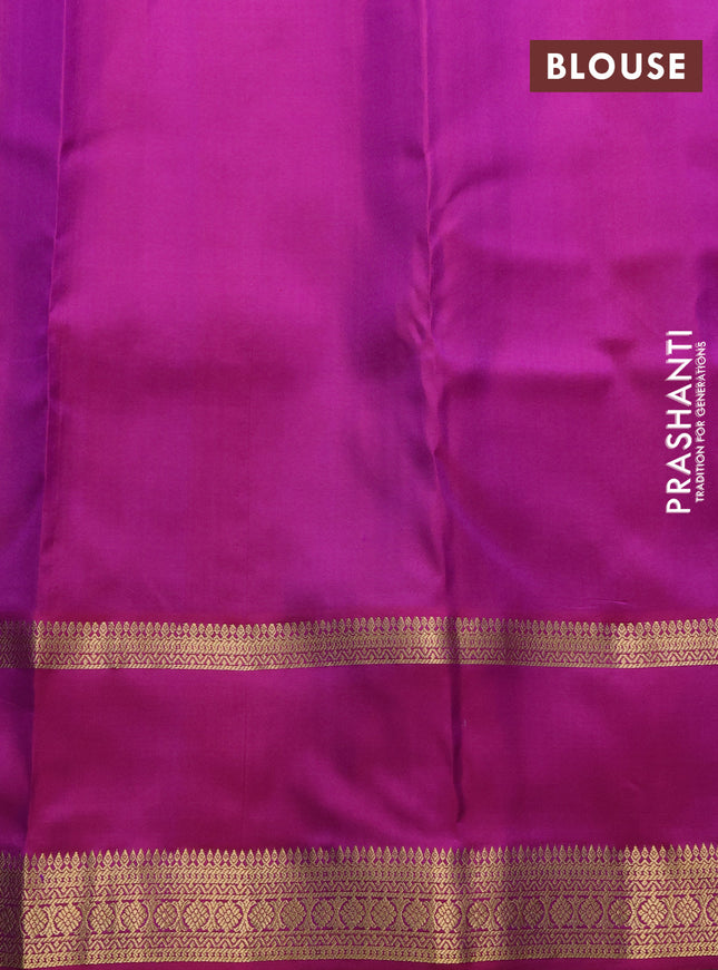 Pure kanchipuram silk saree dual shade of teal green and purple with allover zari woven 1000 buttas and rettapet zari woven border
