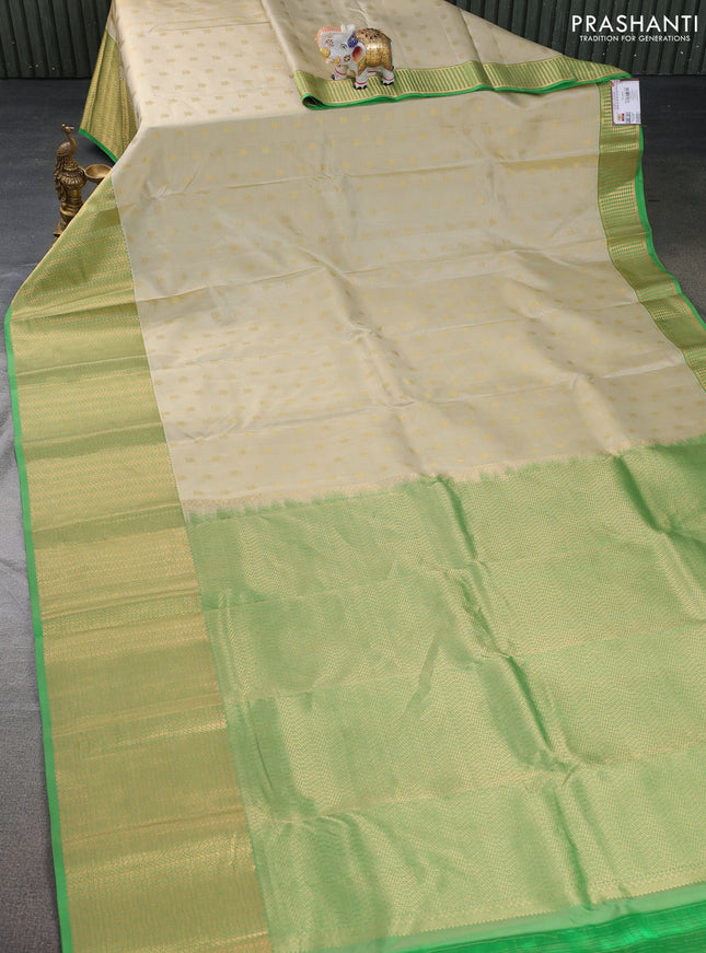 Pure kanchipuram silk saree cream and green with zari woven buttas and zari woven border