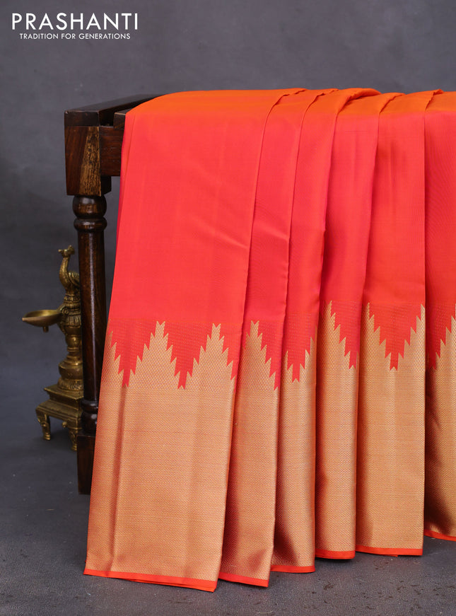 Pure kanchipuram silk saree dual shade of pinkish orange and violet with plain body and temple design zari woven border