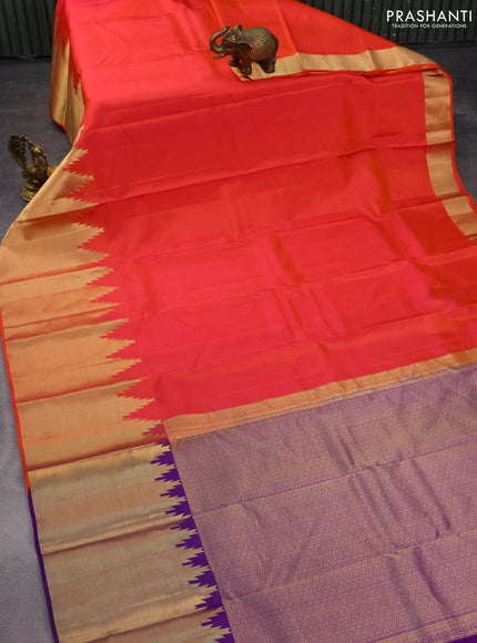Pure kanchipuram silk saree dual shade of pinkish orange and violet with plain body and temple design zari woven border