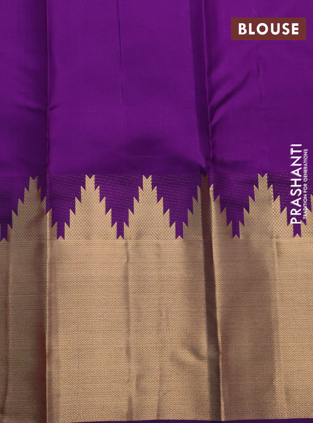 Pure kanchipuram silk saree dual shade of pinkish orange and violet with plain body and temple design zari woven border