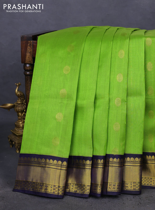 Kuppadam silk cotton saree light green and navy blue with zari woven rudhraksha buttas and zari woven border