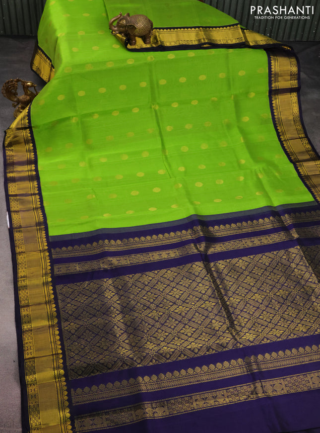 Kuppadam silk cotton saree light green and navy blue with zari woven rudhraksha buttas and zari woven border