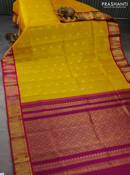 Kuppadam silk cotton saree yellow and purple with zari woven rudhraksha buttas and zari woven border