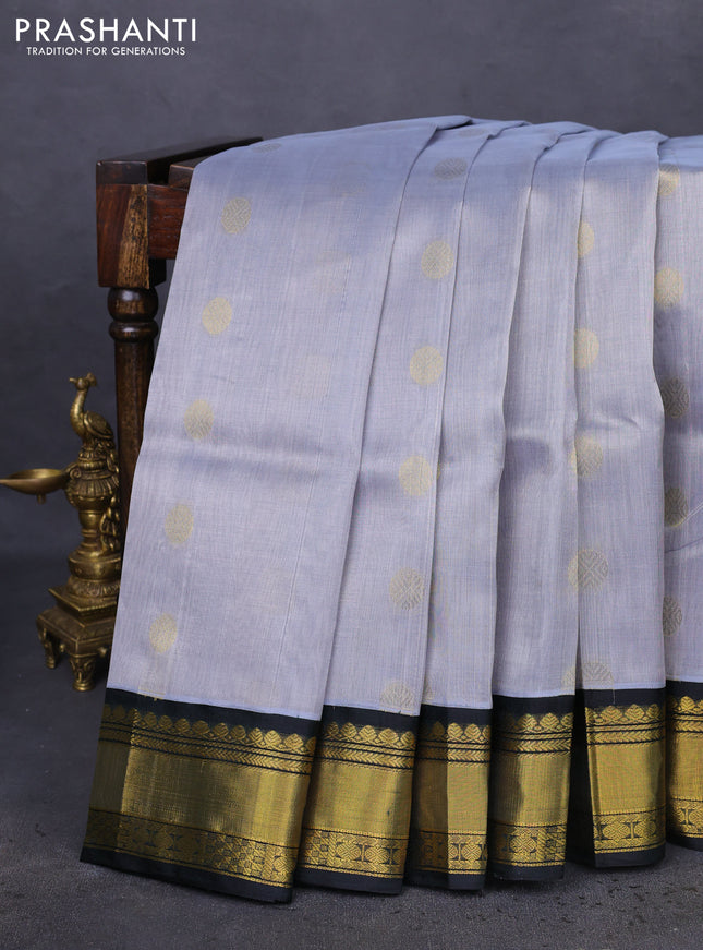 Kuppadam silk cotton saree grey and dark bottle green with zari woven rudhraksha buttas and zari woven border