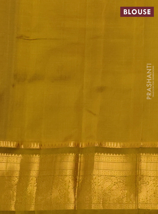Kuppadam silk cotton saree blue and mustard green with allover lakshadeepam weaves and zari woven border