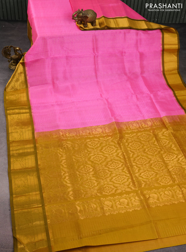 Kuppadam silk cotton saree light pink and mustard green with allover lakshadeepam weaves and zari woven border