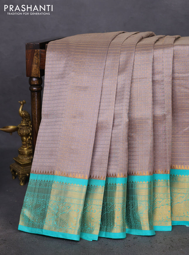 Kuppadam silk cotton saree grey and teal blue shade with allover lakshadeepam weaves and zari woven border