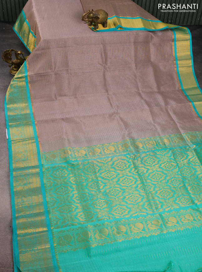 Kuppadam silk cotton saree grey and teal blue shade with allover lakshadeepam weaves and zari woven border