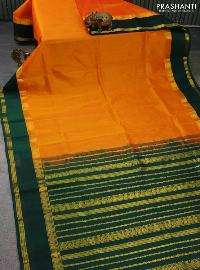Kuppadam silk cotton saree dual shade of mango yellow and bottle green with plain body and rettapet zari woven border