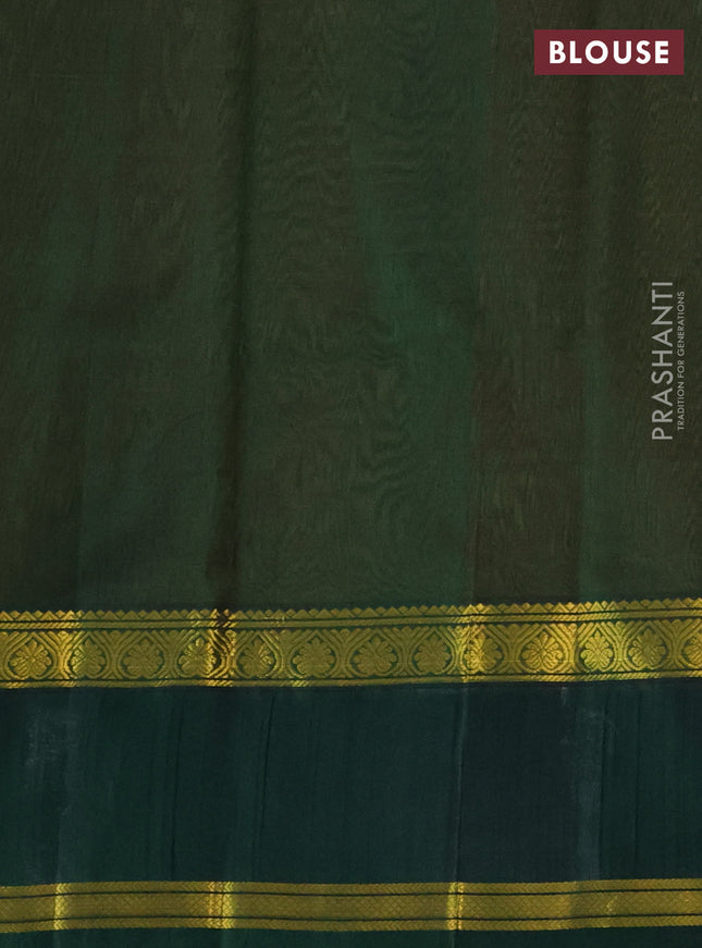 Kuppadam silk cotton saree dual shade of mango yellow and bottle green with plain body and rettapet zari woven border