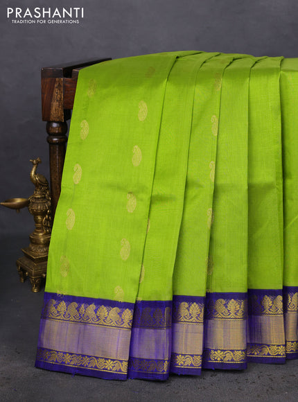 Kuppadam silk cotton saree light green and blue with paisley zari woven buttas and zari woven border