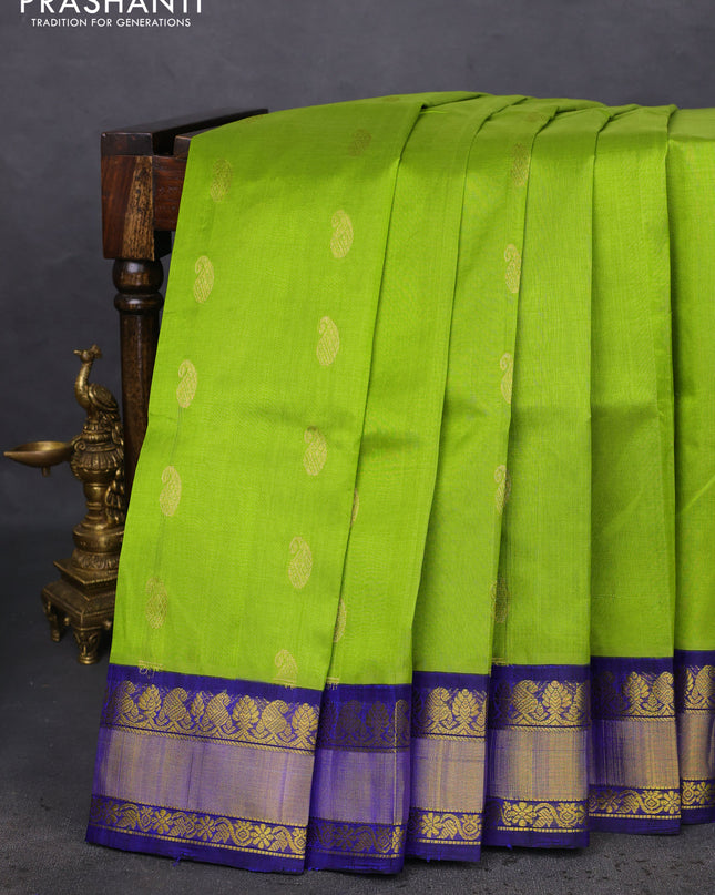 Kuppadam silk cotton saree light green and blue with paisley zari woven buttas and zari woven border